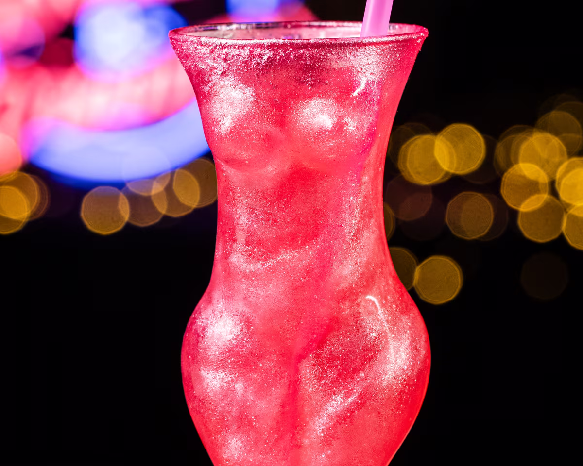 The Pink Barbie — a shimmering pink cocktail in its signature silhouette glass
